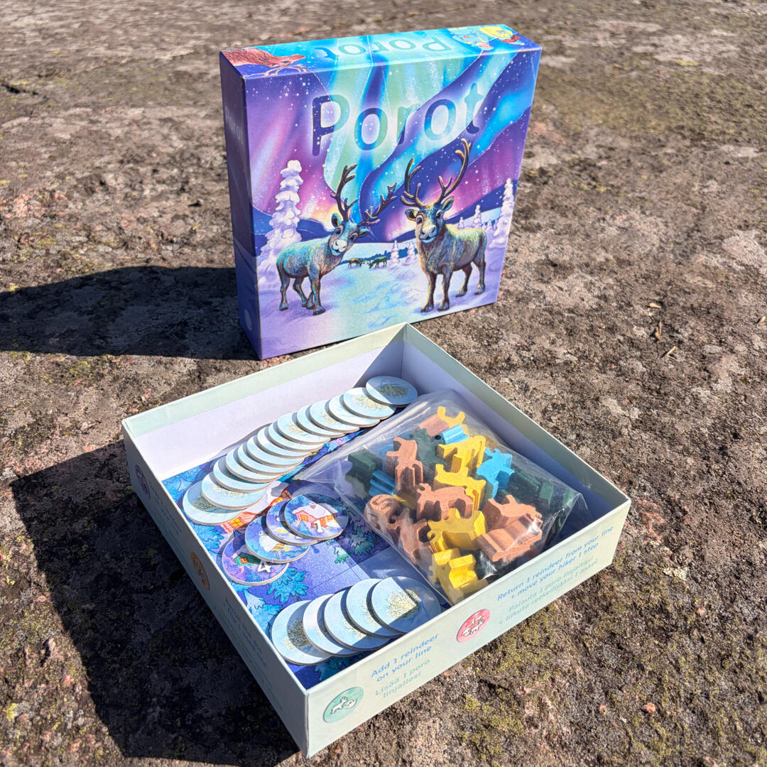 Opened box of Porot board game with components
